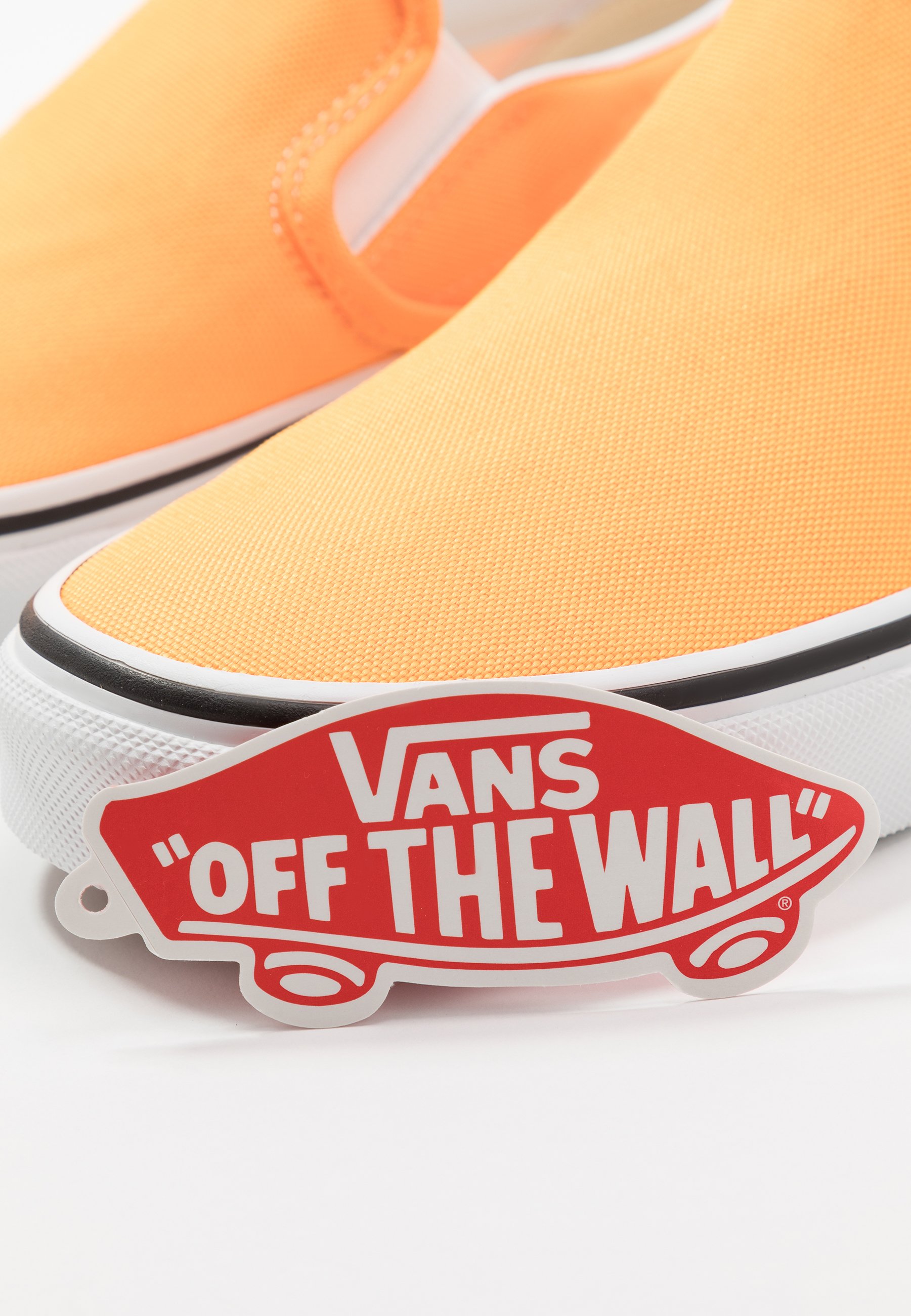 neon orange slip on vans