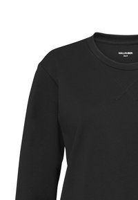 Svart sweatshirt med långa ärmar, rund hals och detaljerad sömnad. Tillverkad av mjukt material, med en avslappnad passform. Storlek 9 etikett synlig.