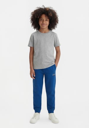 Calvin Klein Jeans MONOGRAM LOGO UNISEX - Tracksuit bottoms - admiral blue