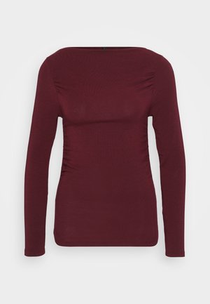 Burgundy long-sleeve top made of soft fabric, featuring a square neckline and side ruching for a fitted design. Smooth texture with no patterns.