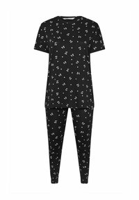 Svart pyjamasset med vitt körsbärsmönster. Kortärmad topp och åtsittande byxor tillverkade av mjukt, andningsbart material. Enkel rund halsringning.