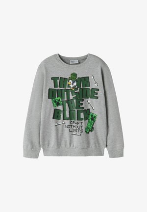 Sweat-shirt gris à manches longues Minecraft avec des lettres en blocs verts, des personnages pixelisés et du texte "Think Outside the Block, Craft Without Limits."
