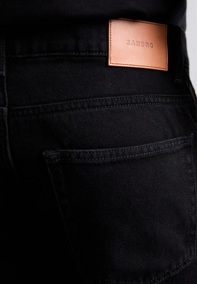 sandro STONEWASH - Relaxed fit jeans - noir