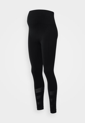 Schwarze Leggings mit hohem Bund, aus dehnbarem Material. Mit horizontalen Streifen am Wadenbereich für zusätzliche Designmerkmale.