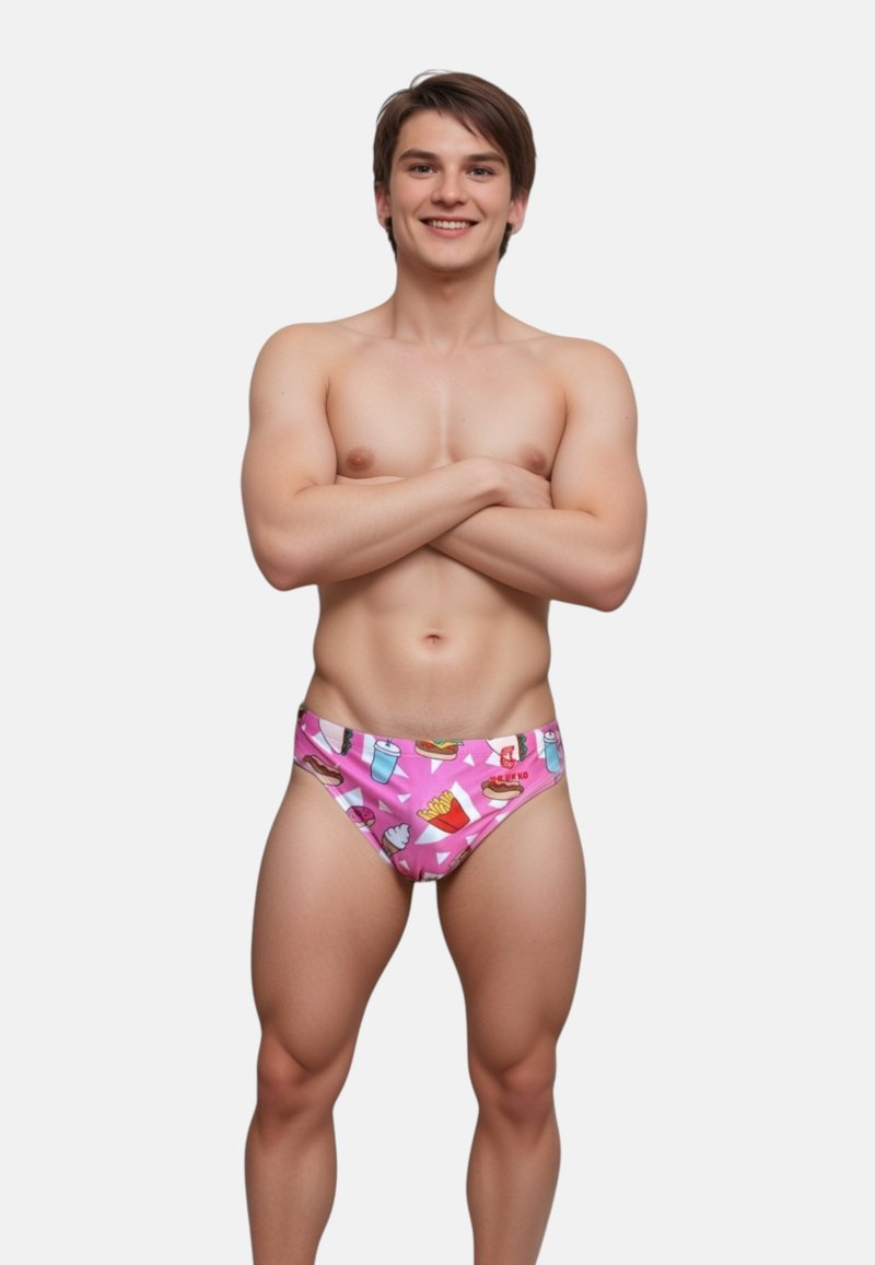 Slip da bagno realizzati in materiale elasticizzato, con uno sfondo rosa e stampe colorate a tema cibo, inclusi hamburger e patatine.