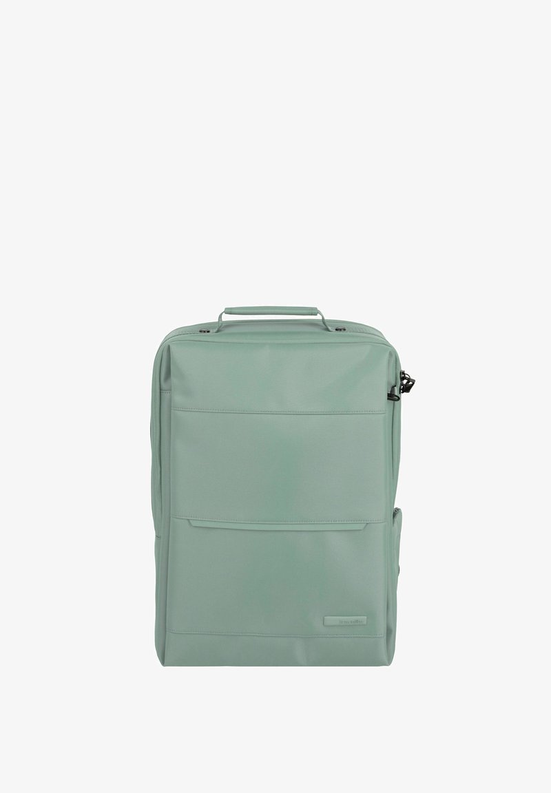 Zaino verde menta con una finitura liscia e strutturata. Presenta una maniglia superiore, una tasca frontale e chiusura a zip. Nessun accento di hardware visibile.