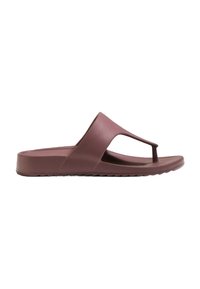 Flip-flop mauve din cauciuc, cu un design cu bretele între degete și o talpă texturată cu un toc ușor. Vârf deschis și decupaje laterale pentru ventilație.