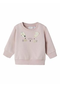 Felpa rosa con una texture morbida, caratterizzata da un design con faccia di coniglio, orecchie pelose e dettagli ricamati. Polsini e orlo a coste.