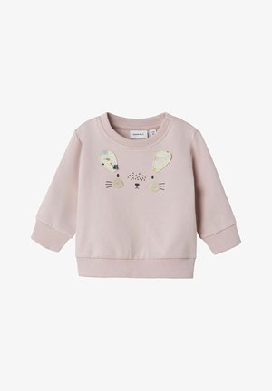 Sudadera rosa con una textura suave, que presenta un diseño de cara de conejo, orejas de felpa y detalles bordados. Puños y dobladillo de canalé.