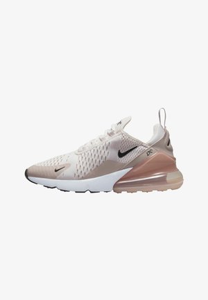 Sneaker Nike Air Max 270 en rose clair avec tige en maille, accents noirs et amorti à air transparent dans le talon. Semelle extérieure en caoutchouc.