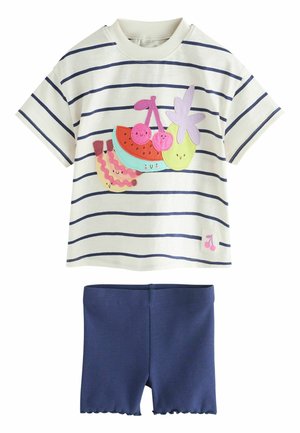 Short-sleeve white shirt with navy stripes featuring colorful smiling fruit patches, paired with solid navy ribbed shorts with scalloped hems.