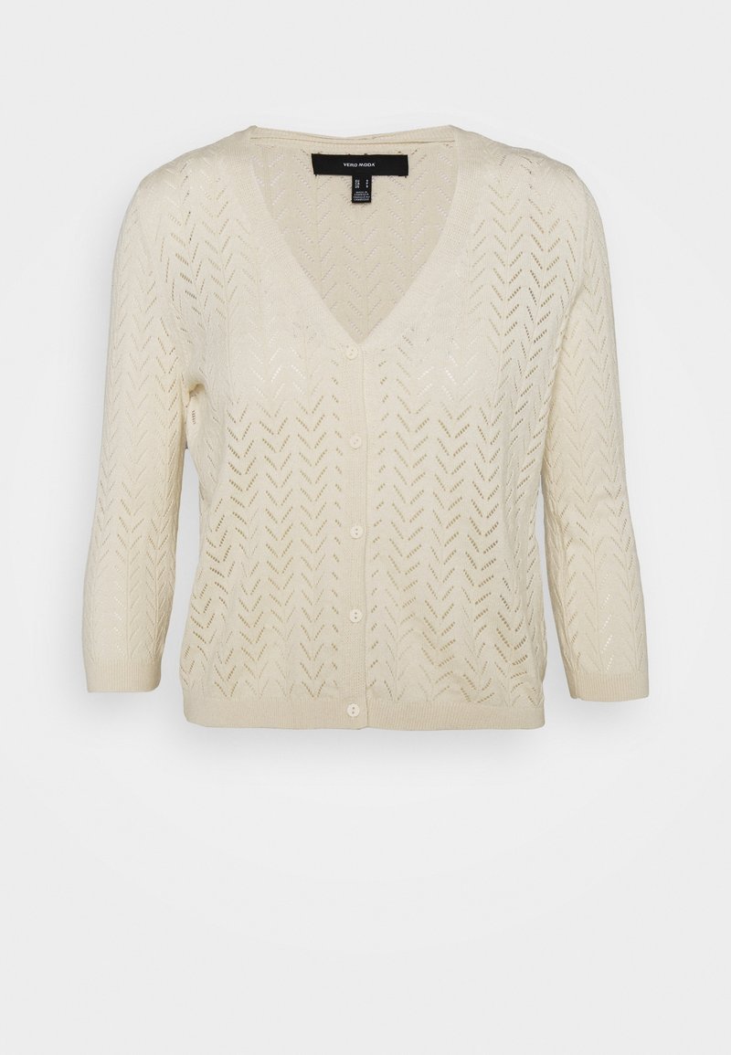 Cardigan lavorato a maglia beige chiaro con scollo a V, maniche a tre quarti e motivo a zigzag. Caratterizzato da chiusura frontale con bottoni e finitura testurizzata.