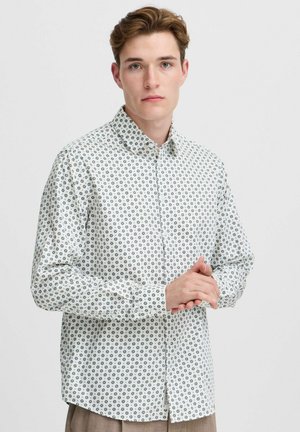 Cămașă albă cu mâneci lungi și butoni, având un model floral albastru închis, guler structurat și manșete cu buton. Material neted cu croi ajustat.