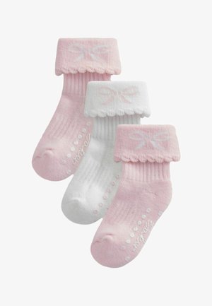 Tri bebi čarape u ružičastoj i bijeloj boji s uvrnutim rubovima ukrašenim dizajnom mašne i protukliznim točkicama na potplatima.