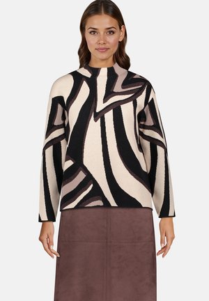 Sweter dzianinowy z abstrakcyjnym wzorem w odcieniach beżu, czerni i brązu, z wysokim kołnierzem i długimi rękawami. Miękka tekstura i luźny krój.