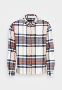 Kostkovaná košile s límečkem na knoflíky, převážně v béžové, tmavě modré a červené barvě, vyrobená z texturované látky s dlouhými rukávy.