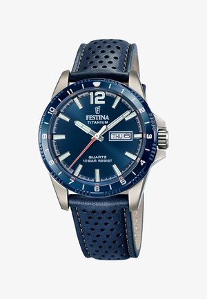 Titanium watch with a dark blue dial, silver accents, quartz movement, and a blue perforated leather strap. Displays date and day.