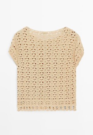 Beżowy krótkosleeve'owy top z dzianiny szydełkowej z kwiatowym wzorem z dziurkami i falbaniastym wykończeniem, ułożony na białym tle.