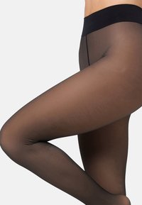 Gennemsigtige sorte strømpebukser med en glat tekstur, har en solid sort talje og et sømløst design, der fremhæver benformen.