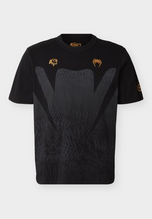 Μαύρο βαμβακερό μπλουζάκι με υφασμένο μοτίβο βαθμίδωσης, χρυσές γραφικές απεικονίσεις ζώων στο στήθος και κλασικό στρογγυλό λαιμόκοψη.