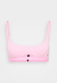 Roze bh met verstelbare bandjes, zachte ribbelstructuur en een brede band. Bevat een centrale uitsparing en een klein logo aan de zijkant.
