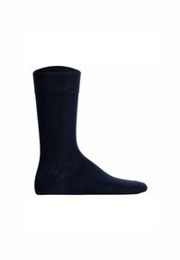 Mørkeblå sok lavet af et glat, strækbart materiale. Har en ribbet kant og en sømløs tå. Klassisk ankel-længde design.
