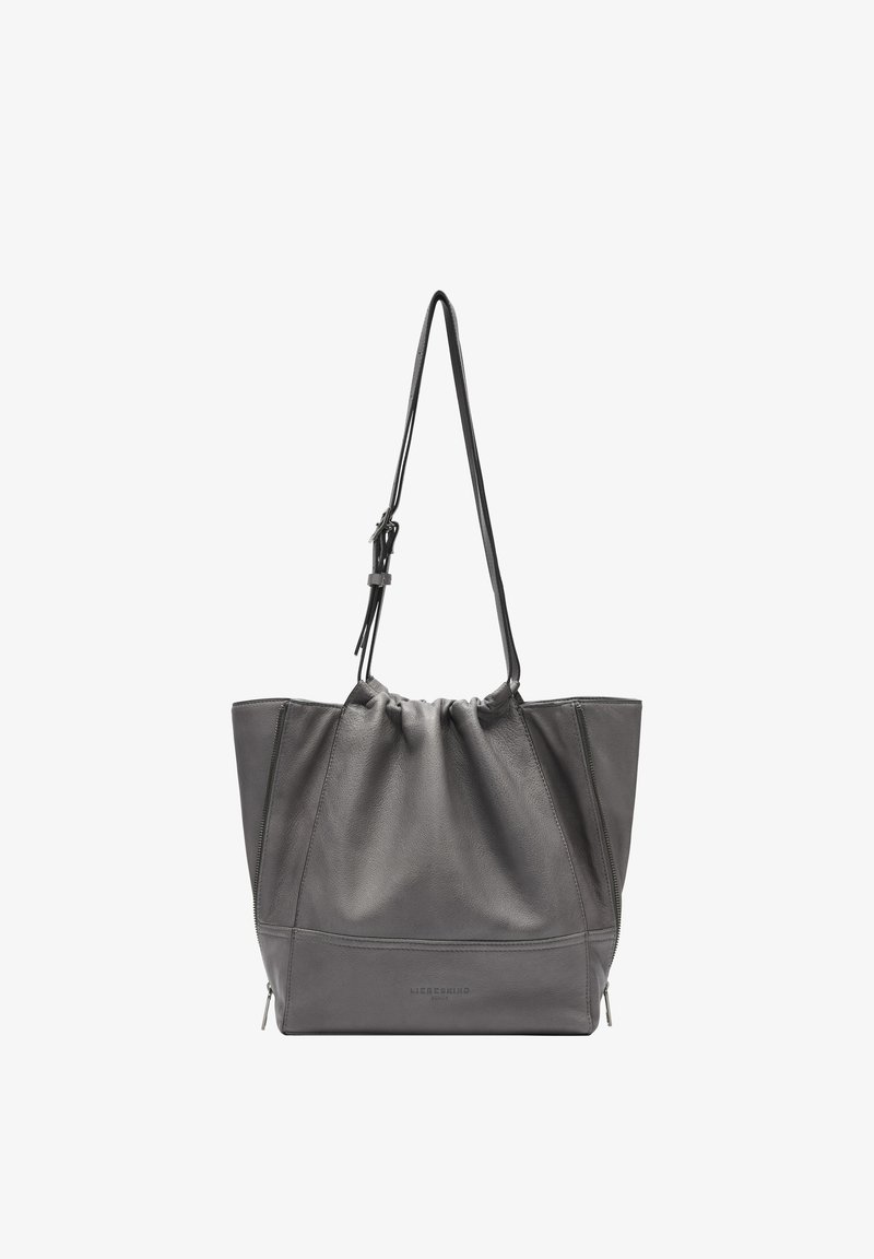 Sac fourre-tout en cuir gris avec un haut froncé, des zips latéraux doubles et une sangle ajustable, doté d'une texture lisse et de coutures définies.