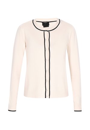 Šviesiai rožinė megztinė su ilgomis rankovėmis, juodu apdaila aplink apvalų kaklą ir mygtukų eilutę, su mažais apvaliais mygtukais ir iškiliais rankogaliais.