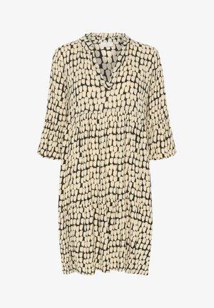 Black dress featuring a printed pattern of cream oval shapes. The design includes a V-neck and short sleeves with a loose, tiered fit.