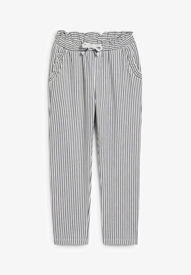 Pantalon blanc à rayures noires verticales, taille élastique avec cordon blanc, et deux poches avant avec bordure à volants.