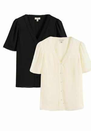 Dwie bluzki z krótkim rękawem, jedna czarna, druga biała, z dekoltem w kształcie litery V, przodem na guziki oraz falistą lamówką na dekolcie i rękawach.