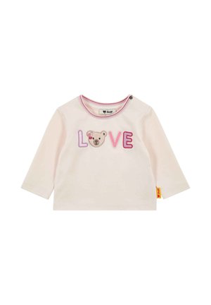 Cremefarbener Langarmshirt für Kleinkinder mit dem eingestickten Schriftzug "LOVE", wobei das "O" durch ein Bärengesicht ersetzt ist, und einem pink gestreiften Halsausschnitt.