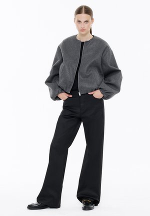 Loose Jeans - coated black
