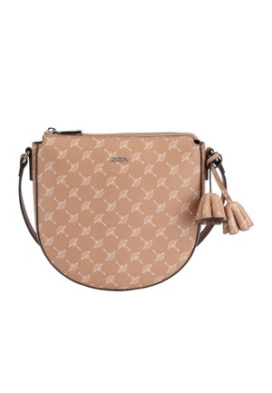 Beige crossbody bag with repeating light pattern, silver brand logo, zip closure, and decorative tassels on the side.