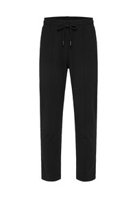 Zwarte joggingsbroek van zacht materiaal, met een elastische tailleband en een trekkoord, taps toelopende pijpen en zijzakken.