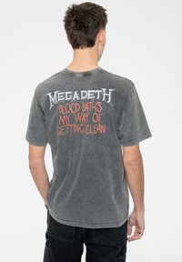 Gray cotton t-shirt with short sleeves featuring a graphic print of "Megadeth" in white and orange text on the back.