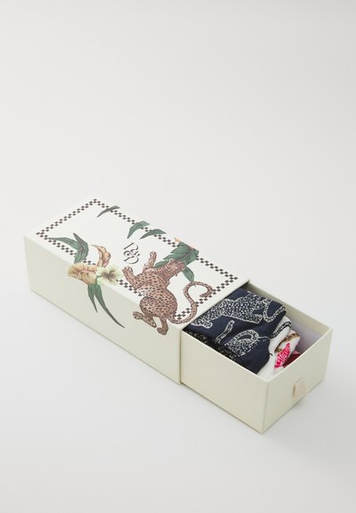 Rectangular gift box with a leopard design and floral accents. Contains rolled socks in dark and light colors, displayed inside.