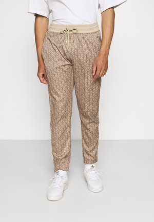 MONOGRAM TRACK PANT - Pantalon de survêtement - beige