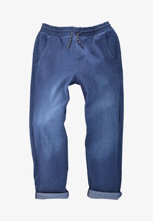Blue denim jogger pants with elastic waistband, black and white drawstring, side pockets, and rolled cuffs.