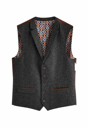Gilet gris foncé moucheté avec cinq boutons, bordure marron sur les poches et doublure intérieure colorée à motif géométrique.
