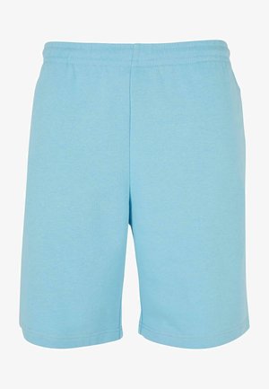 Világoskék sportnadrág puha anyagból, elasztikus derékkal és egyszerű, laza szabással. Simaság és szegélyezett szélek.