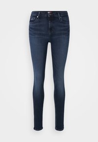 Jeans ajustados de mezclilla azul oscuro con cintura de altura media, diseño de cinco bolsillos y cierre de botón. Textura suave con un ligero desvanecimiento.