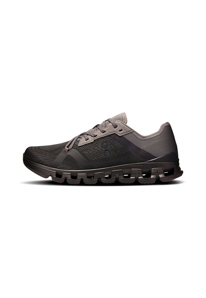 Black athletic shoe with a breathable mesh upper, reinforced overlays, and cushioned sole featuring segmented pods for flexibility.