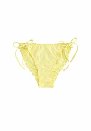 Fondo di bikini giallo realizzato in materiale morbido, con accenti testurizzati e lacci regolabili su ciascun lato.