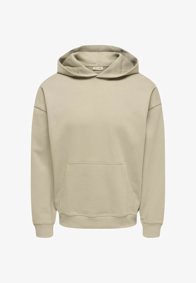 Bēšs kapucis ar priekšējo kabatu, garām piedurknēm, ribaina aproču apdare un vaļēja piegriezuma. Izgatavots no mīksta, teksturēta kokvilnas maisījuma auduma.