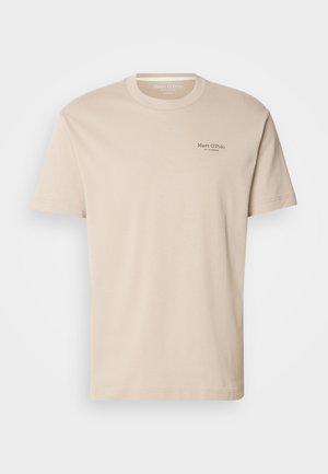 Beige cotton crew neck t-shirt with short sleeves. Features front logo print and a relaxed fit. Fabric appears soft and smooth.