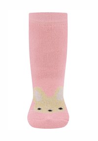 Rosa gestrickte Socken mit einem Hasendesign an der Spitze, gelben Akzenten und schwarzen Gesichtszügen. Weiche Textur, mittellange Wadenlänge.