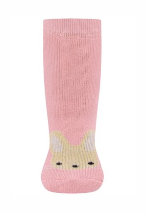 Pink knitted socks featuring a bunny design at the toe with yellow accents and black facial details. Soft texture, mid-calf length.