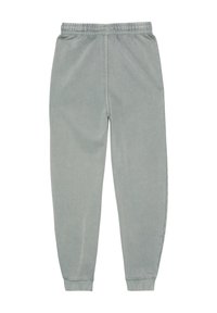 Lichtgrijze sweatpants met een elastische tailleband en taps toelopende enkelboorden. Zacht, glad materiaal zonder zichtbare patronen of accenten.