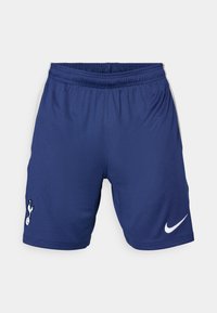 Shorts sportivi Nike di colore blu scuro, con vita elasticizzata, accenti bianchi sui lati e un logo del club sulla gamba sinistra.